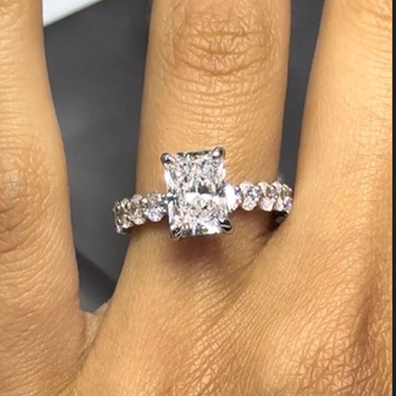 Honorable 7.0Ct Radiant Cut Engagement Ring with Oval Cut Band