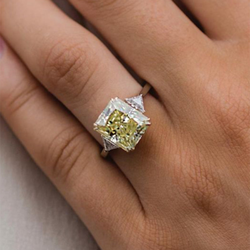 Radiant Cut Yellow Stone Two-Tone Engagement Ring With Triangle Cut Side-stones