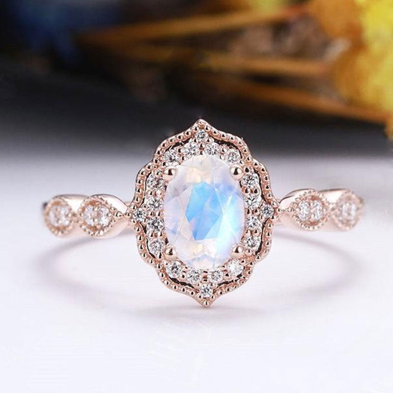 Rose Gold Oval Cut Moonstone Engagement Ring In Sterling Silver