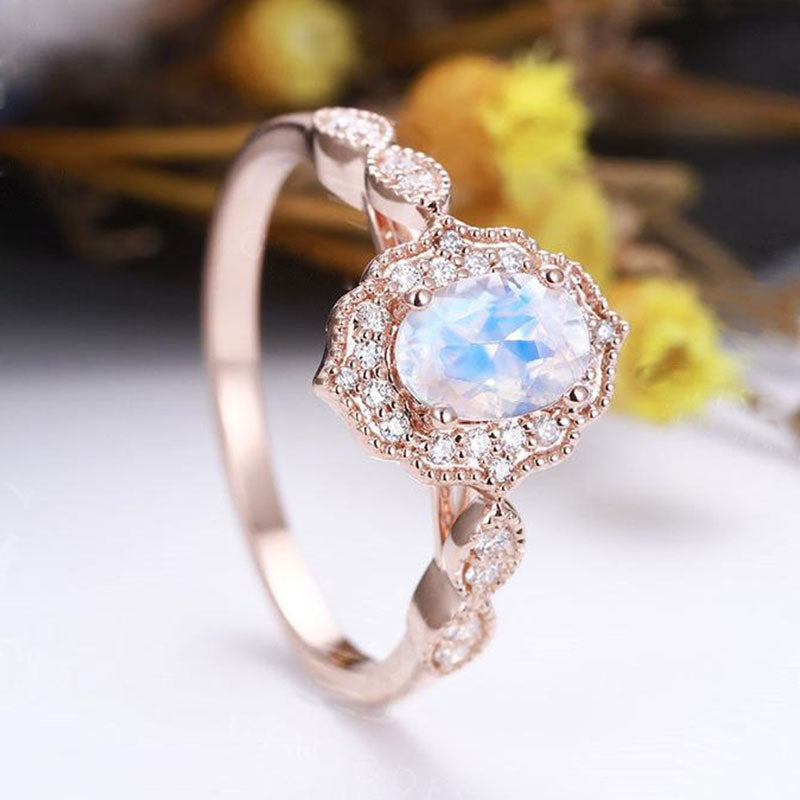 Rose Gold Oval Cut Moonstone Engagement Ring In Sterling Silver