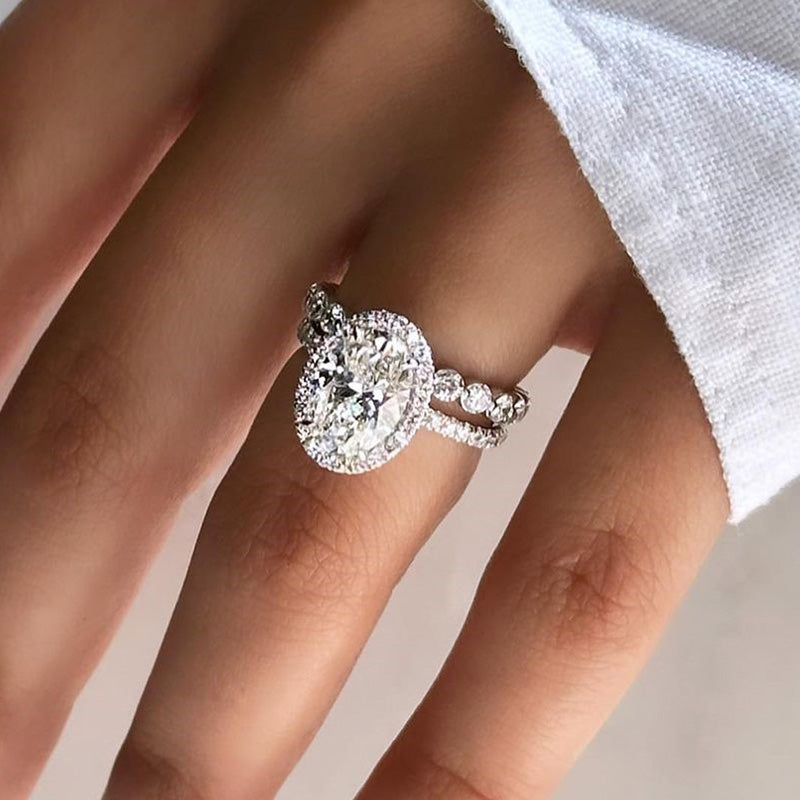Desirable Halo Oval Cut Wedding Set For Women In Sterling Silver