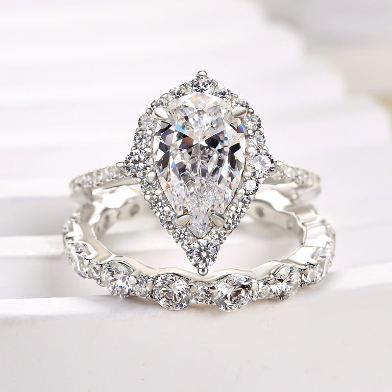 Lovely Halo Pear Cut Bridal Ring Set In Sterling Silver