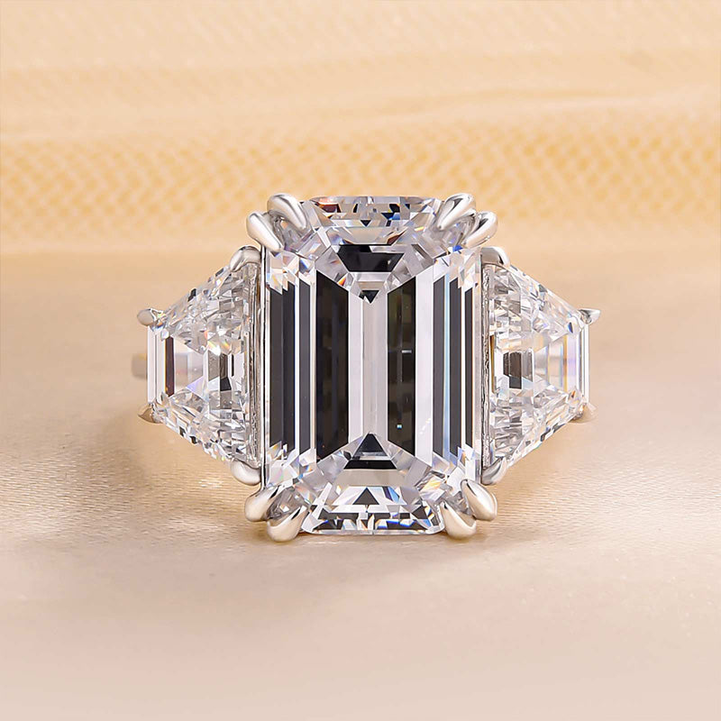Luxurious Emerald Cut Three Stone Engagement Ring In Sterling Silver