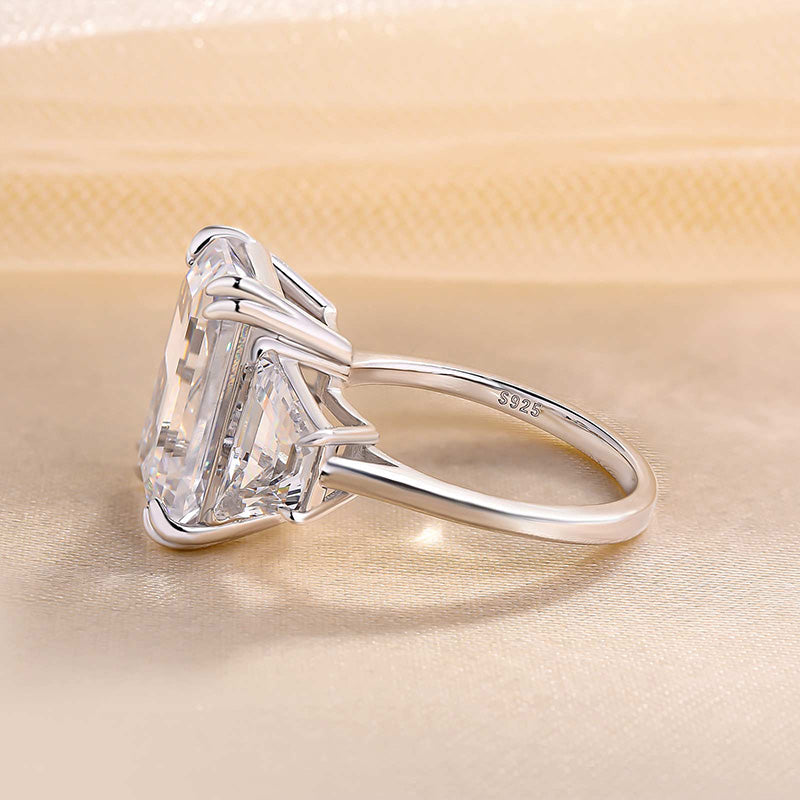Luxurious Emerald Cut Three Stone Engagement Ring In Sterling Silver