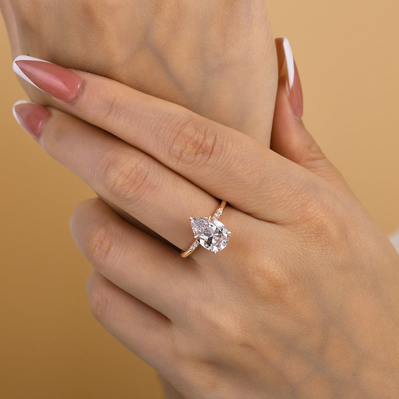 Elegant Rose Gold Pear Cut Engagement Ring In Sterling Silver