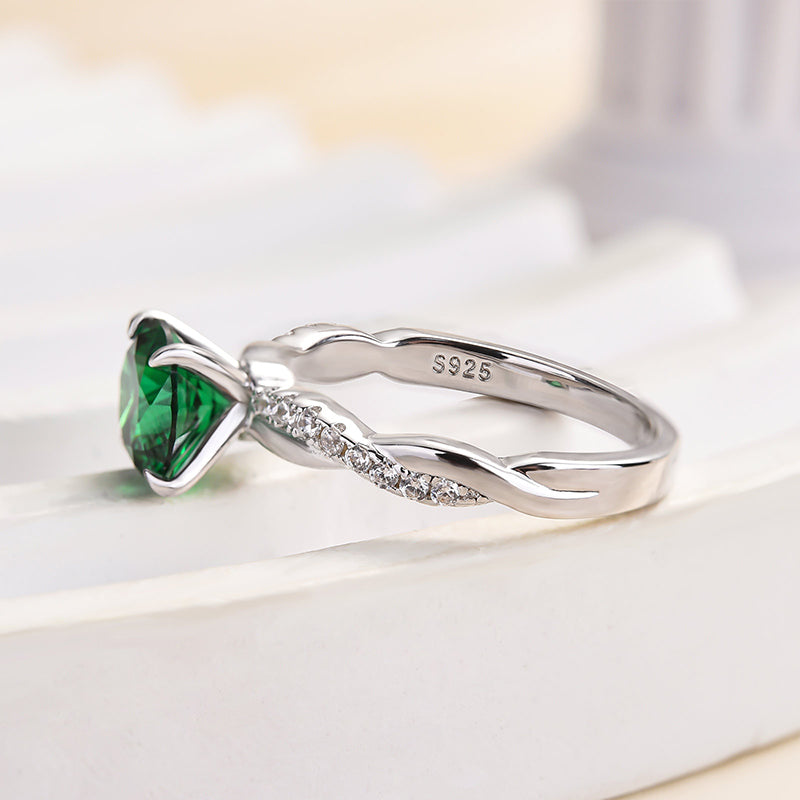 Twist Round Cut Emerald Green Engagement Ring In Sterling Silver