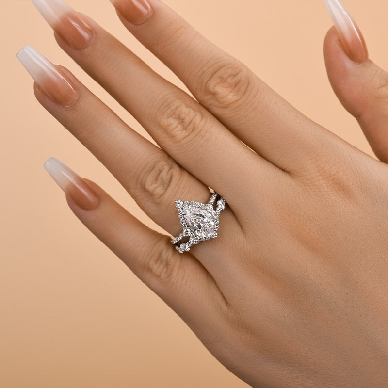 Lovely Halo Pear Cut Bridal Ring Set In Sterling Silver