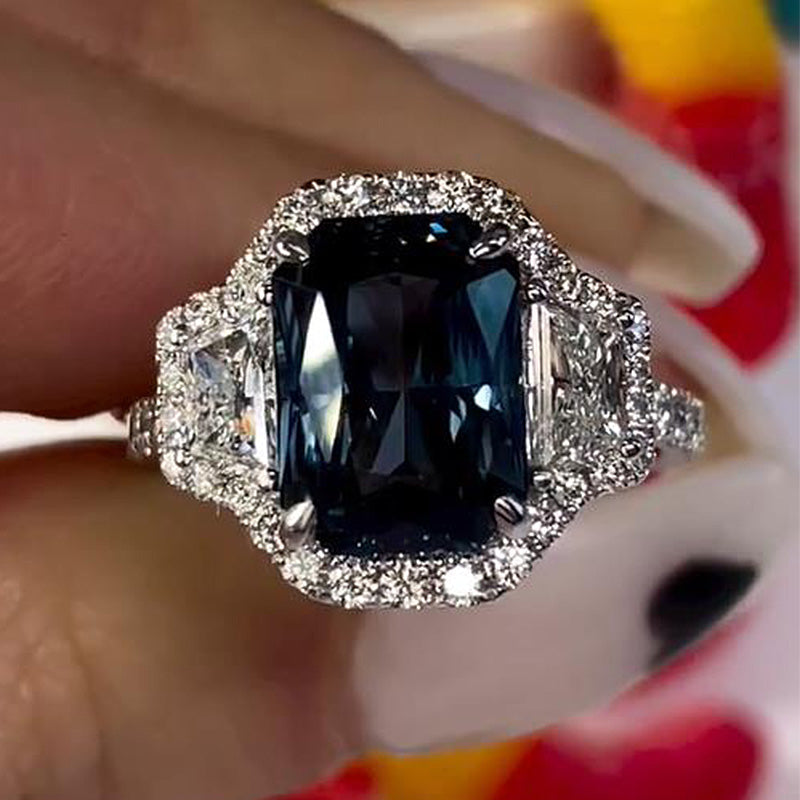 Gorgeous Halo Blue Sapphire Radiant Cut Three Stone Engagement Ring In Sterling Silver