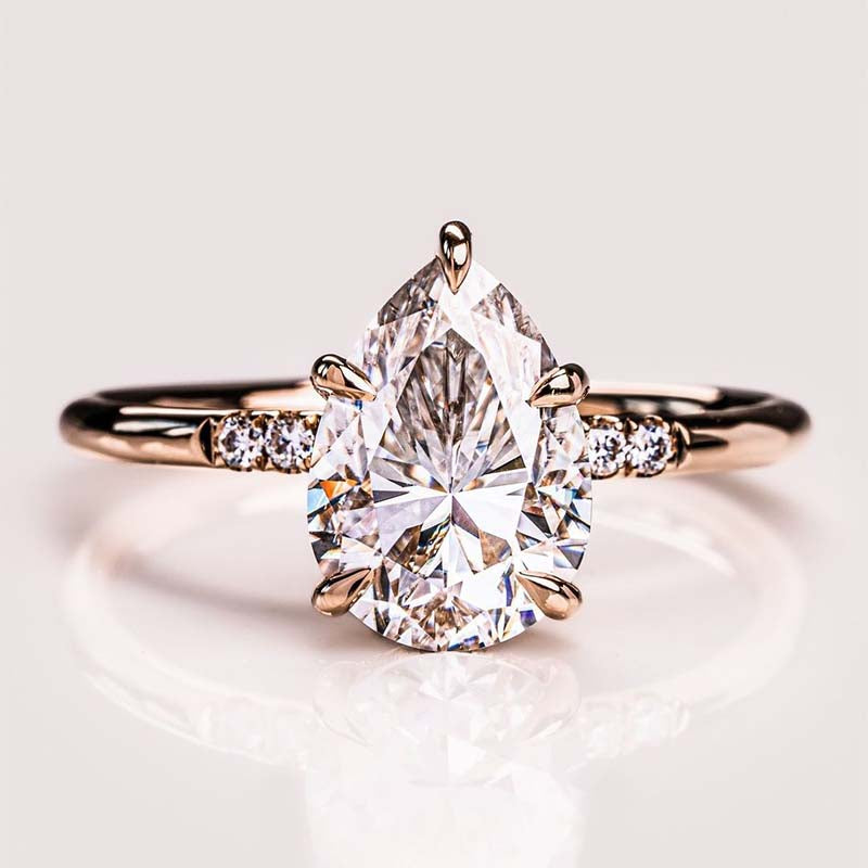 Elegant Rose Gold Pear Cut Engagement Ring In Sterling Silver