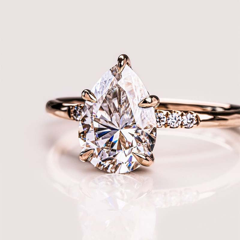 Elegant Rose Gold Pear Cut Engagement Ring In Sterling Silver