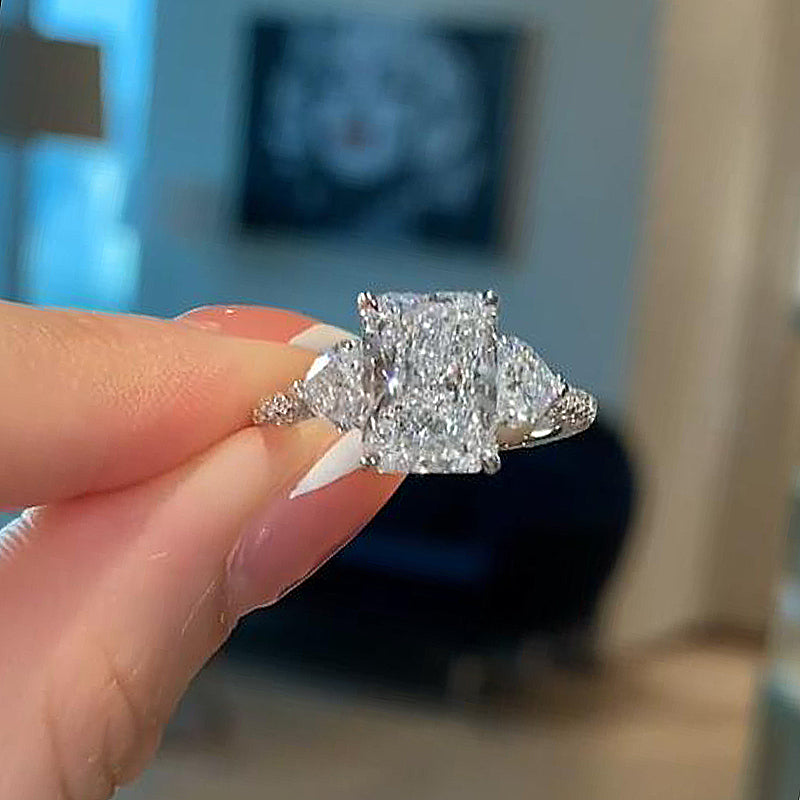 Luxurious Radiant Cut & Heart Cut Three Stone Engagement Ring In Sterling Silver