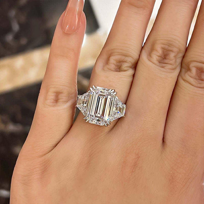 Luxurious Emerald Cut Three Stone Engagement Ring In Sterling Silver