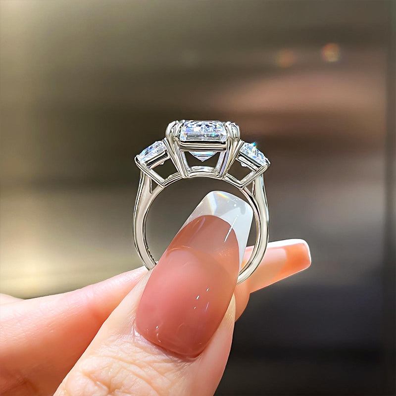Luxurious Emerald Cut Three Stone Engagement Ring In Sterling Silver