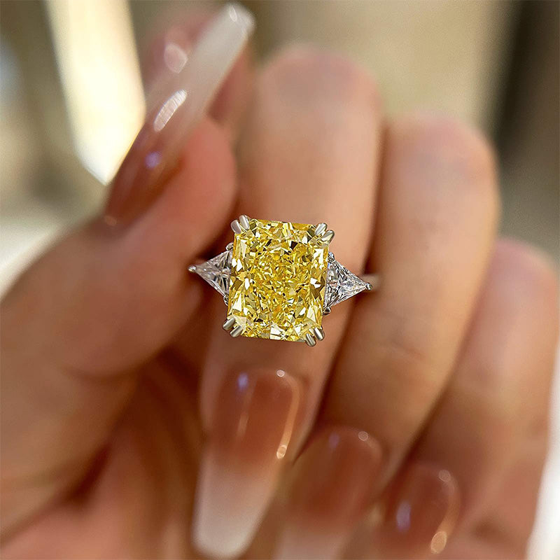 Radiant Cut Yellow Stone Two-Tone Engagement Ring With Triangle Cut Side-stones