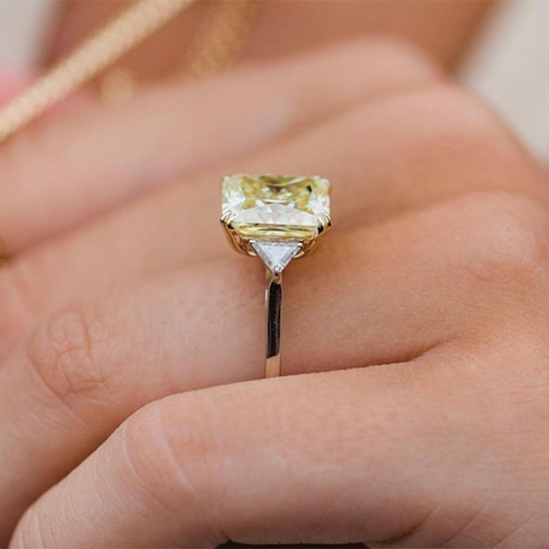 Radiant Cut Yellow Stone Two-Tone Engagement Ring With Triangle Cut Side-stones