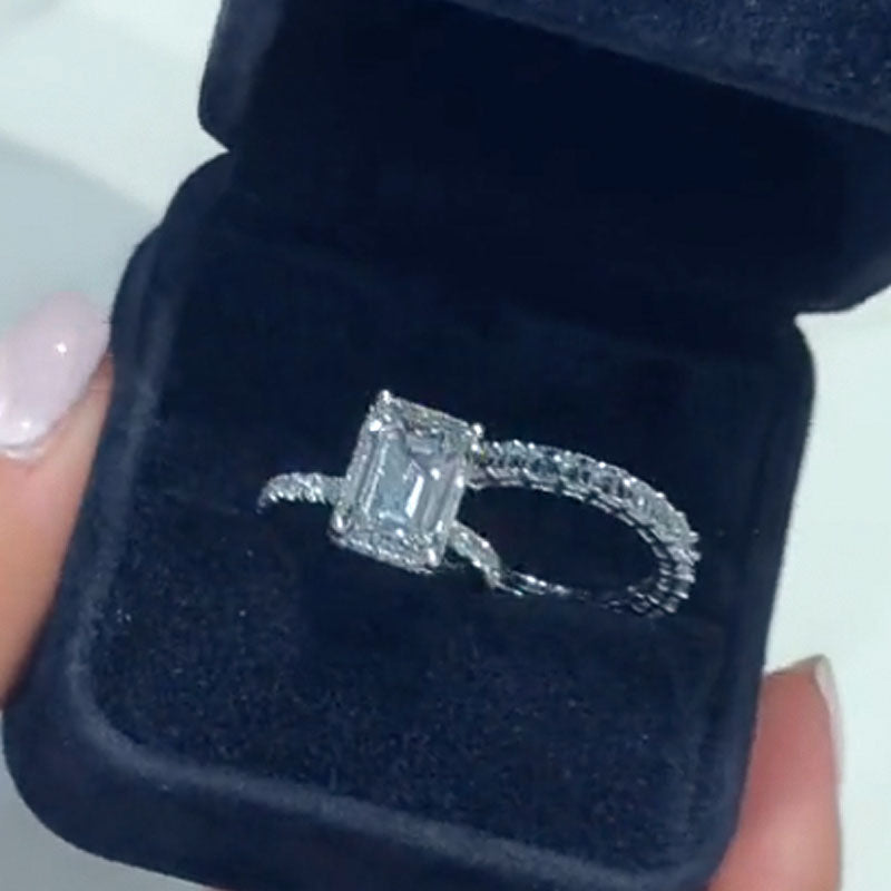 Maxine Luxurious Emerald Cut Wedding Ring Set In Sterling Silver
