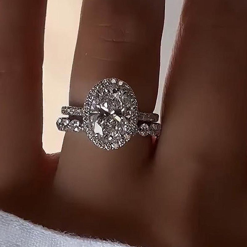 Desirable Halo Oval Cut Wedding Set For Women In Sterling Silver