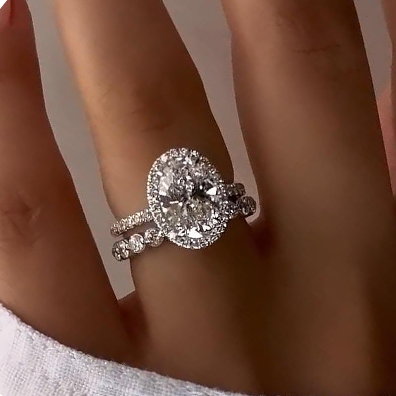 Desirable Halo Oval Cut Wedding Set For Women In Sterling Silver