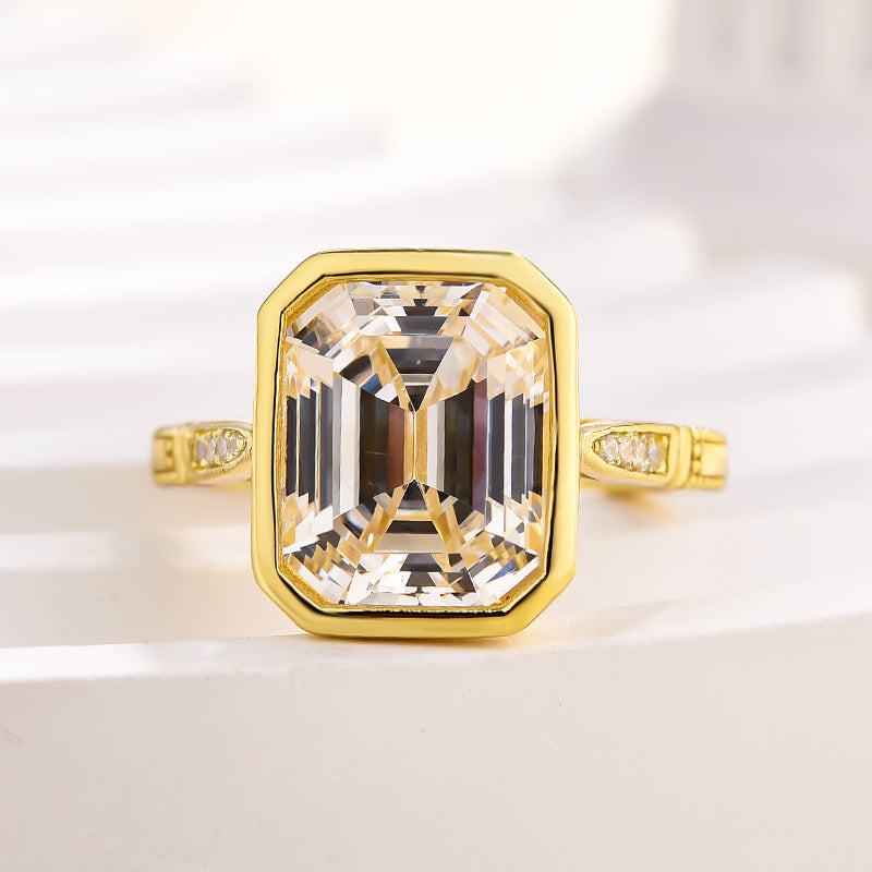 Luxurious Yellow Gold Emerald Cut Bezel Engagement Ring In Sterling Silver