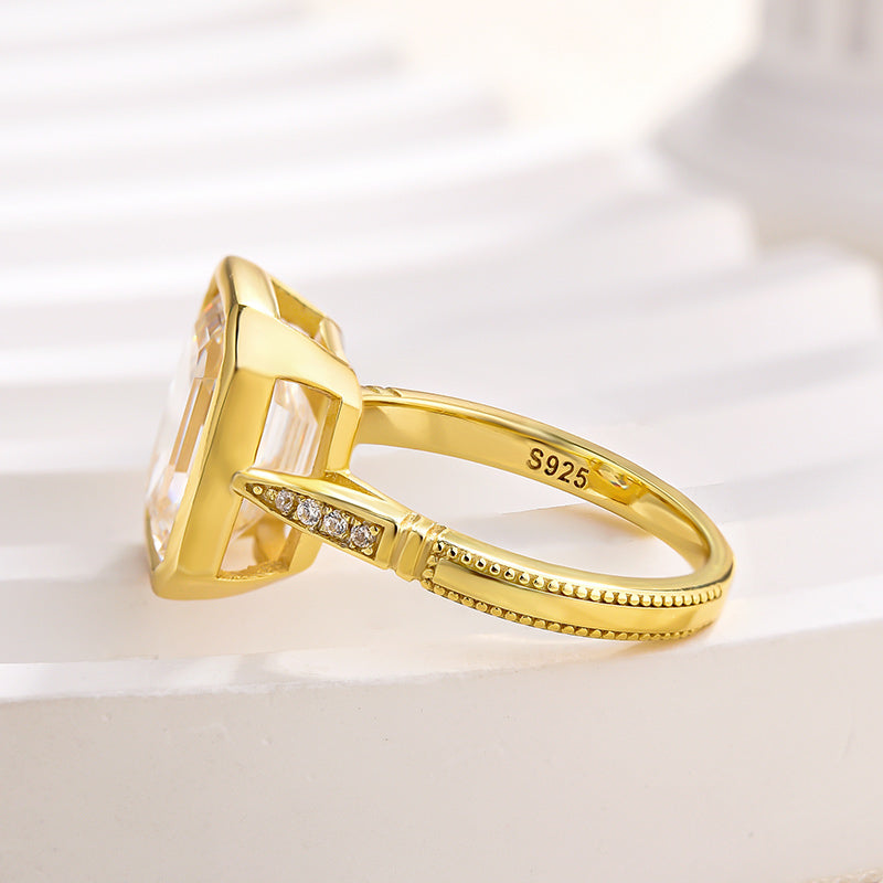 Luxurious Yellow Gold Emerald Cut Bezel Engagement Ring In Sterling Silver