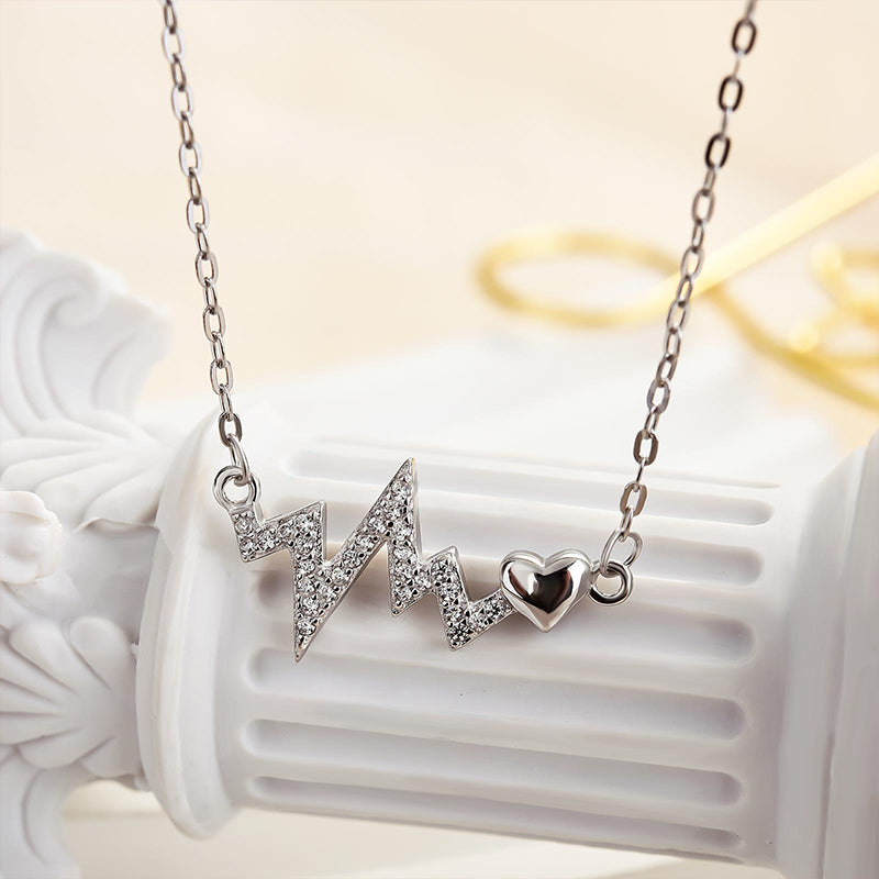 Sterling Silver Round Cut Created Sapphire Heartbeat Pendant Necklace For Women
