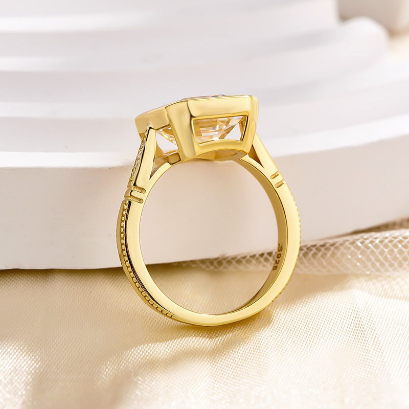 Luxurious Yellow Gold Emerald Cut Bezel Engagement Ring In Sterling Silver