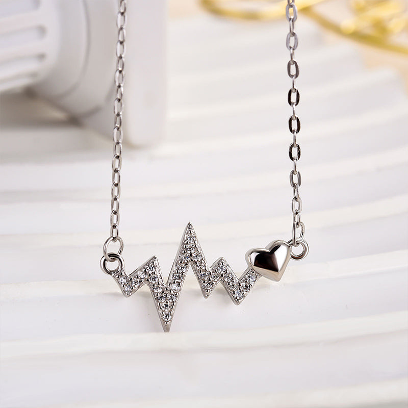 Sterling Silver Round Cut Created Sapphire Heartbeat Pendant Necklace For Women