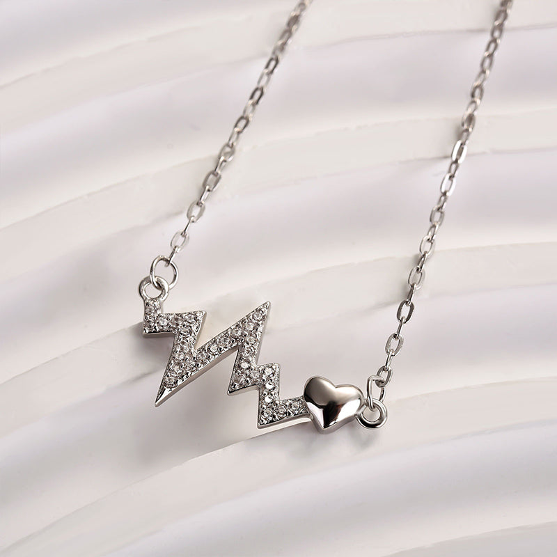 Sterling Silver Round Cut Created Sapphire Heartbeat Pendant Necklace For Women