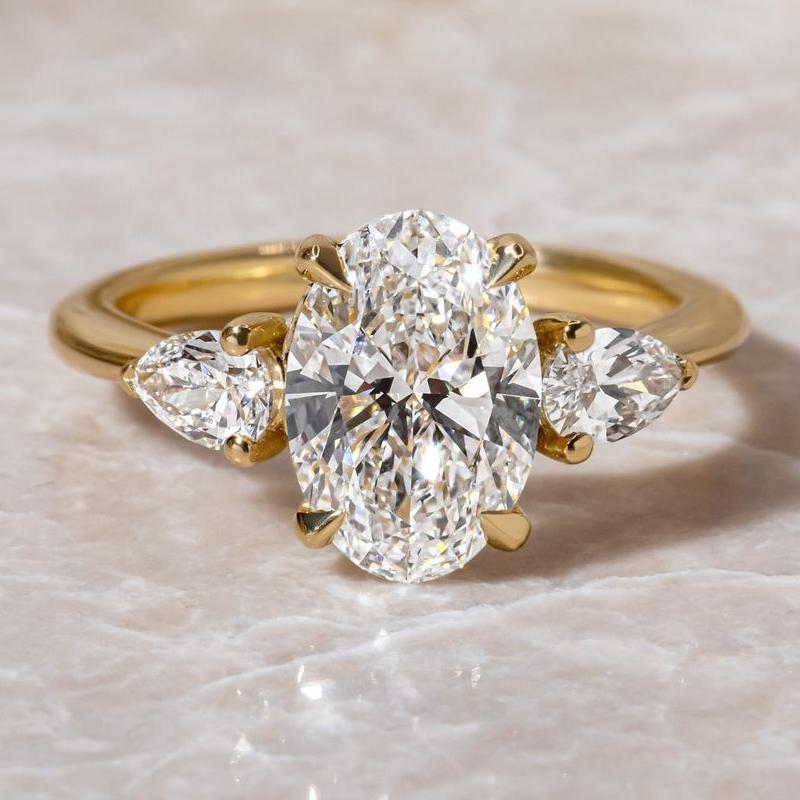 Noble Oval Cut Three Stone Engagement Ring