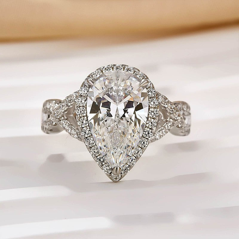4.0Ct Halo Pear Cut Twist Travel Ring In Sterling Silver
