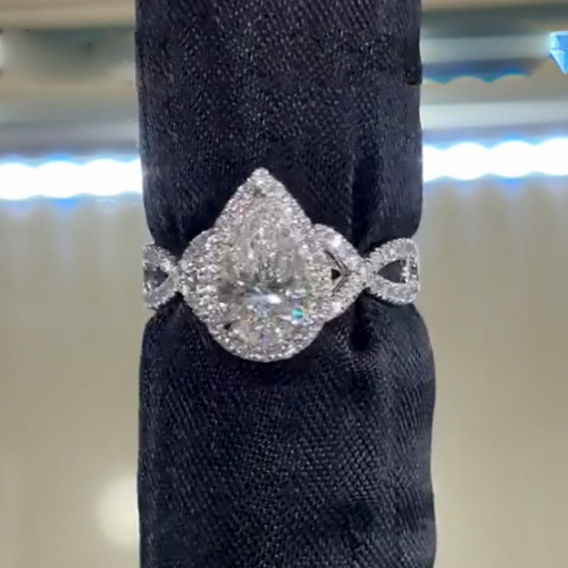 4.0Ct Halo Pear Cut Twist Travel Ring In Sterling Silver