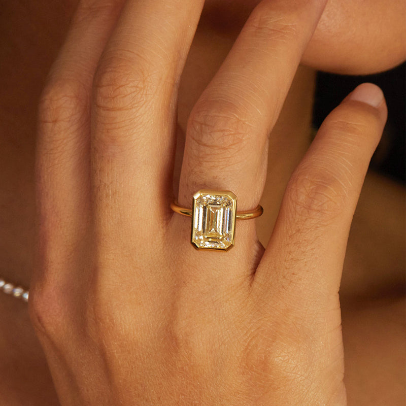 Unique Yellow Gold Emerald Cut Bezel Engagement Ring In Sterling Silver