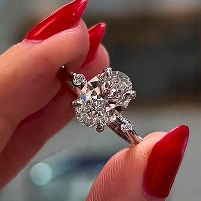 Elegant Oval Cut Engagement Ring In Sterling Silver