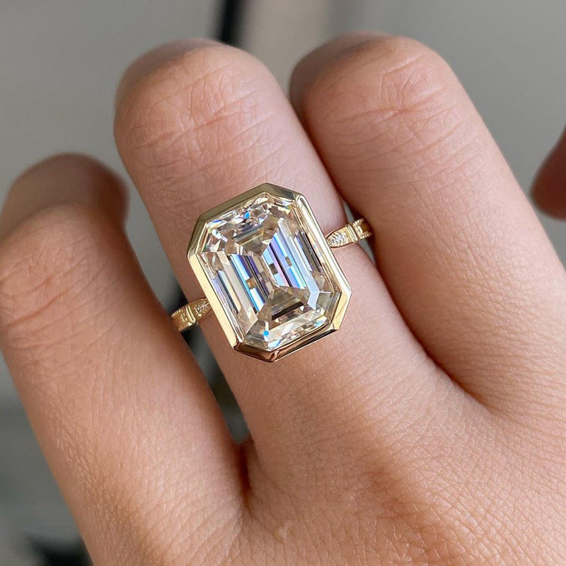 Luxurious Yellow Gold Emerald Cut Bezel Engagement Ring In Sterling Silver