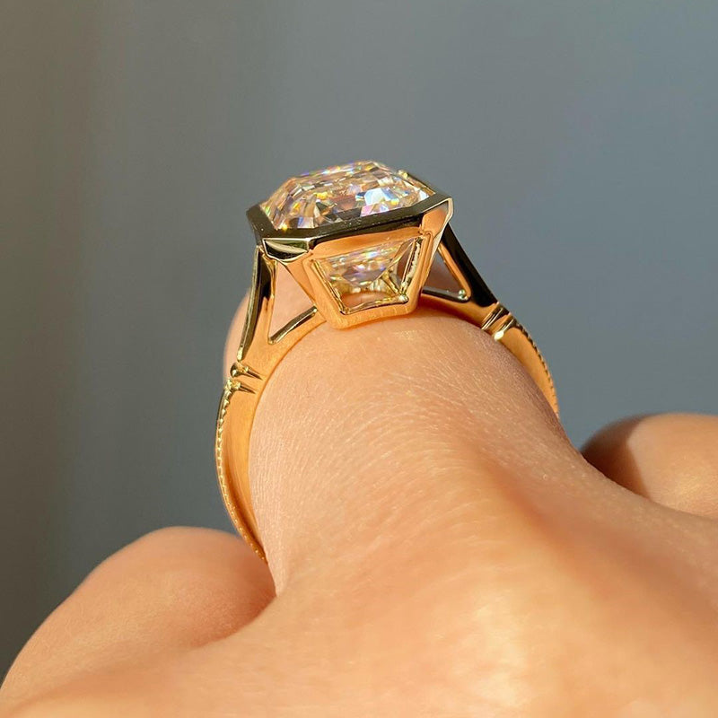 Luxurious Yellow Gold Emerald Cut Bezel Engagement Ring In Sterling Silver